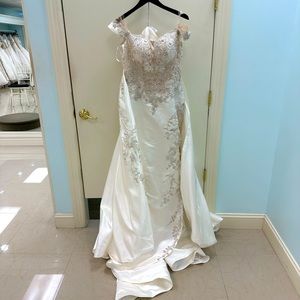 Two in one dress that is sold as is. Dress has only been worn for alterations.